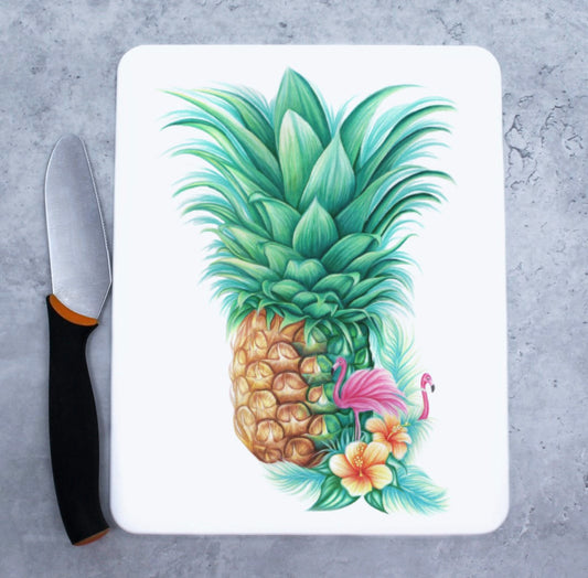 Skärbräda med ananas och flamingos